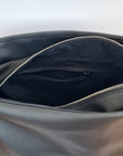 Cactus leather tote back with curved bottom panel, and adjustable buckled strap