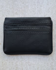 Black pebble textured 5 card wallet made from vegan cactus leather with subtle piping detail on edge