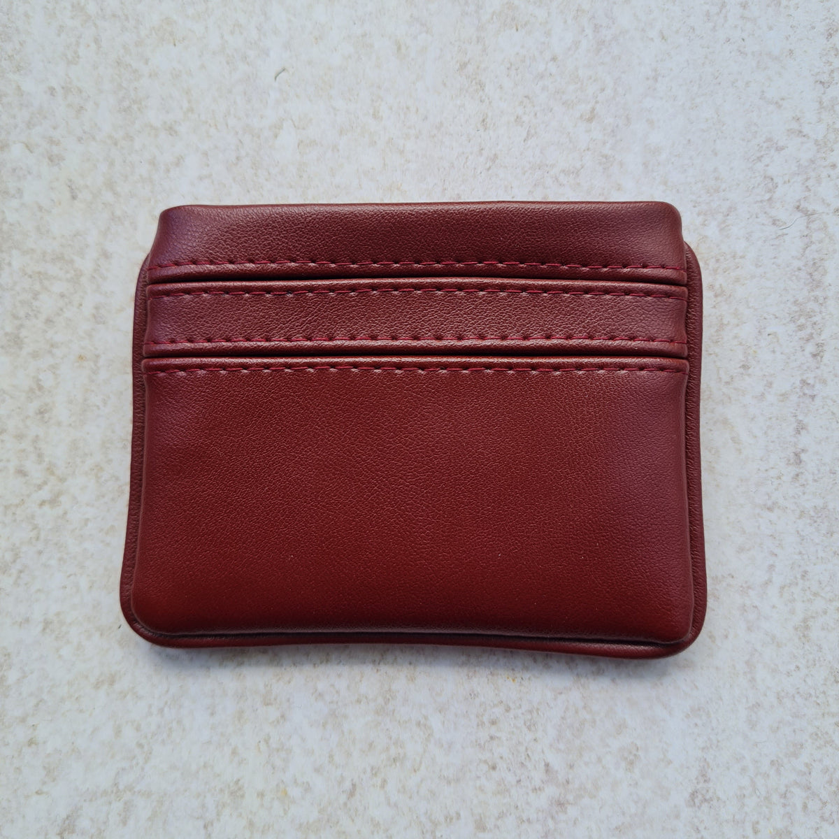 Cherry red 5 card wallet made from vegan cactus leather with subtle piping detail on edge