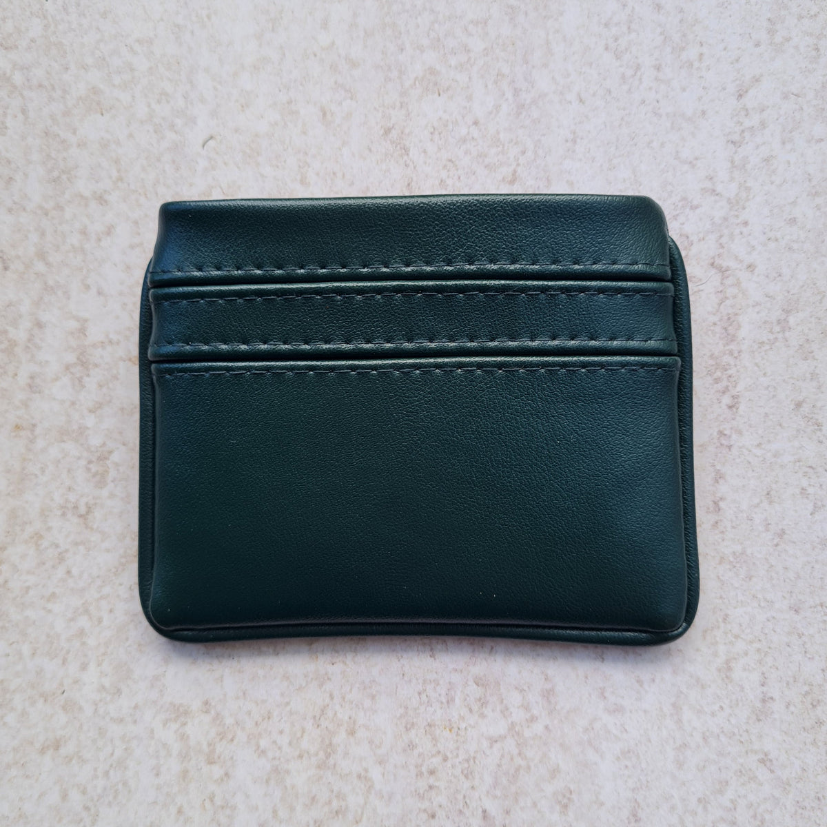 Dark forest green 5 card wallet made from vegan cactus leather with subtle piping detail on edge
