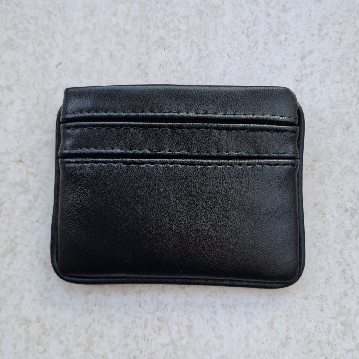 Black 5 card wallet made from vegan cactus leather with subtle piping detail on edge