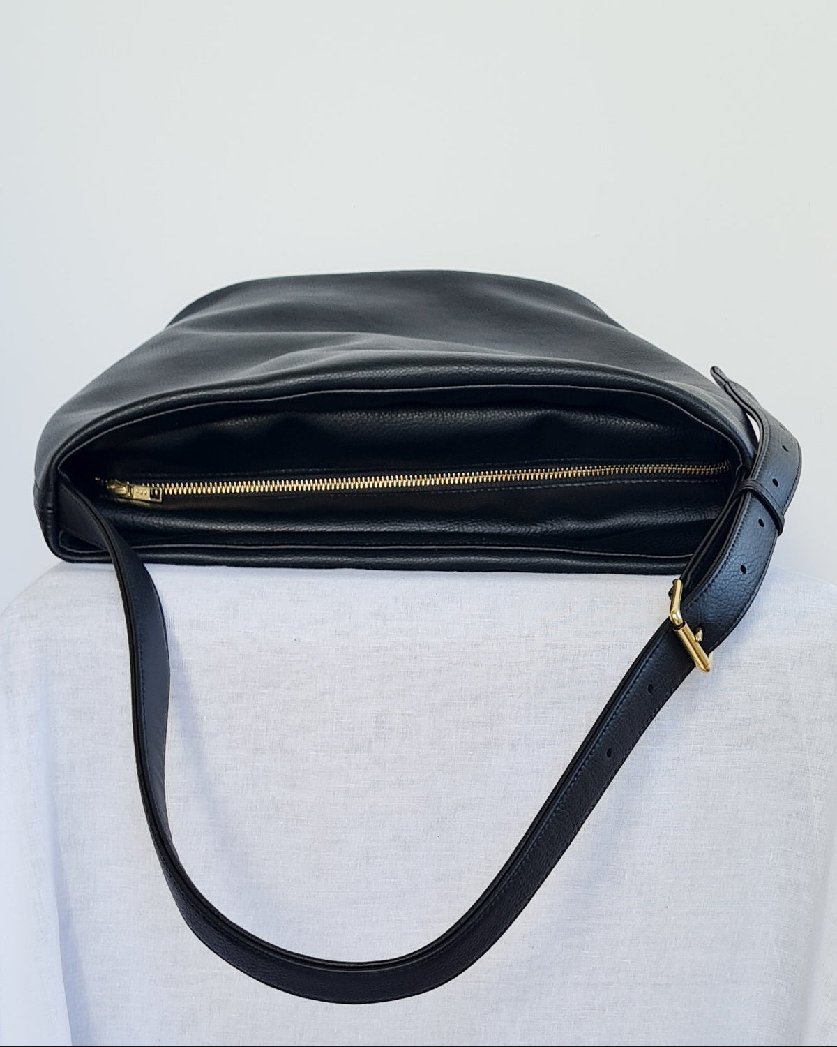 Large bucket tote made from cactus leather with an adjustable buckle strap