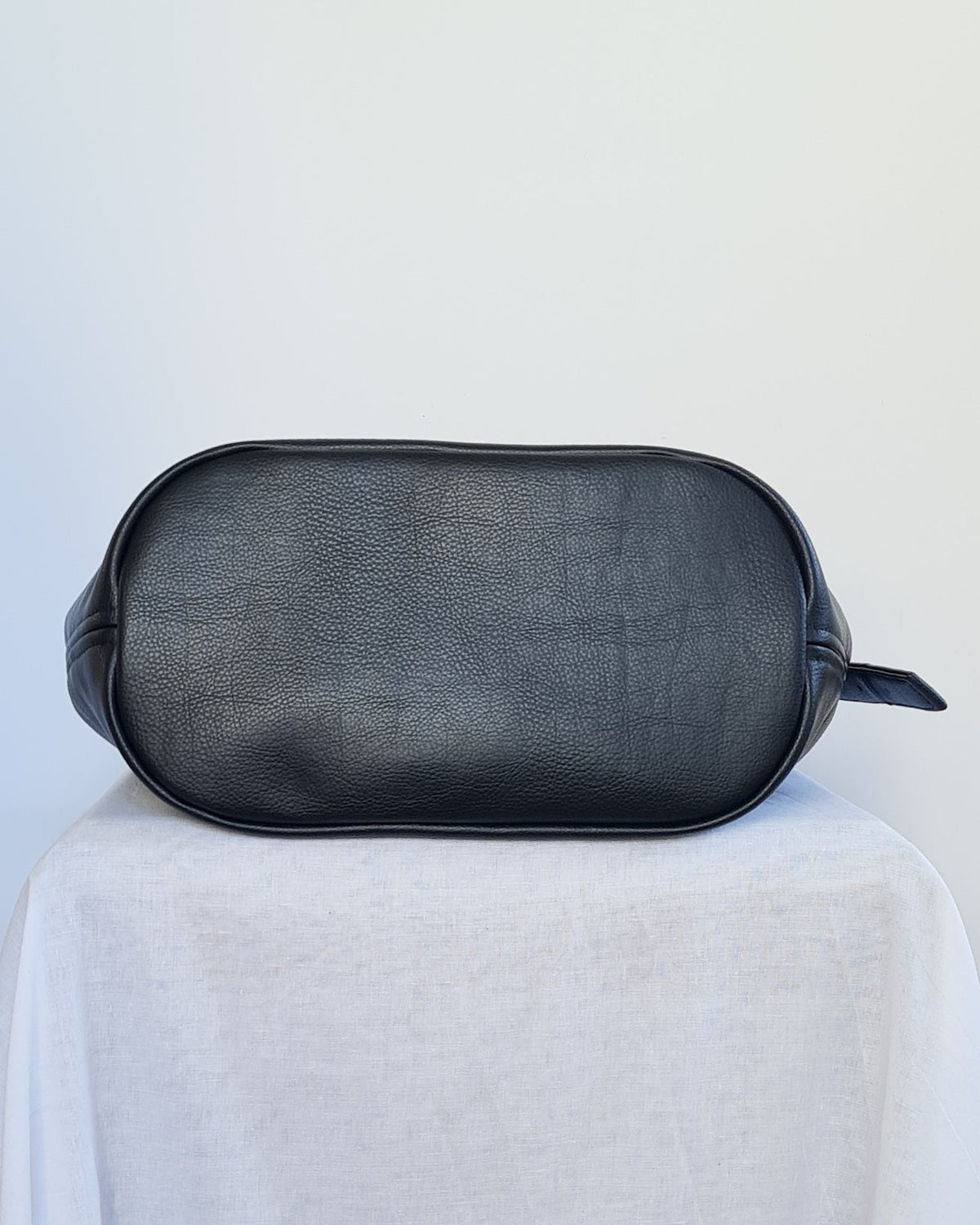 Large bucket tote made from cactus leather with an adjustable buckle strap
