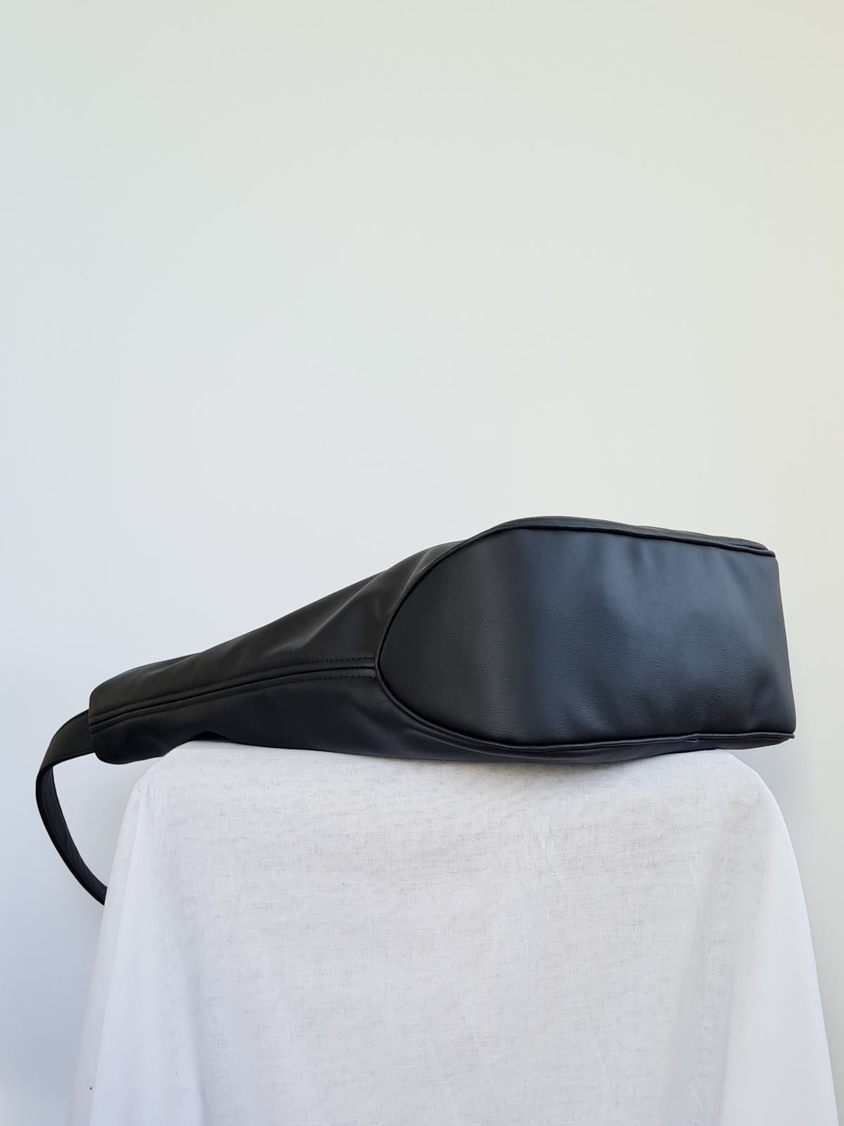 Cactus leather tote back with curved bottom panel, and adjustable buckled strap