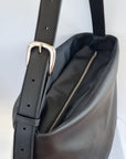 Cactus leather tote back with curved bottom panel, and adjustable buckled strap