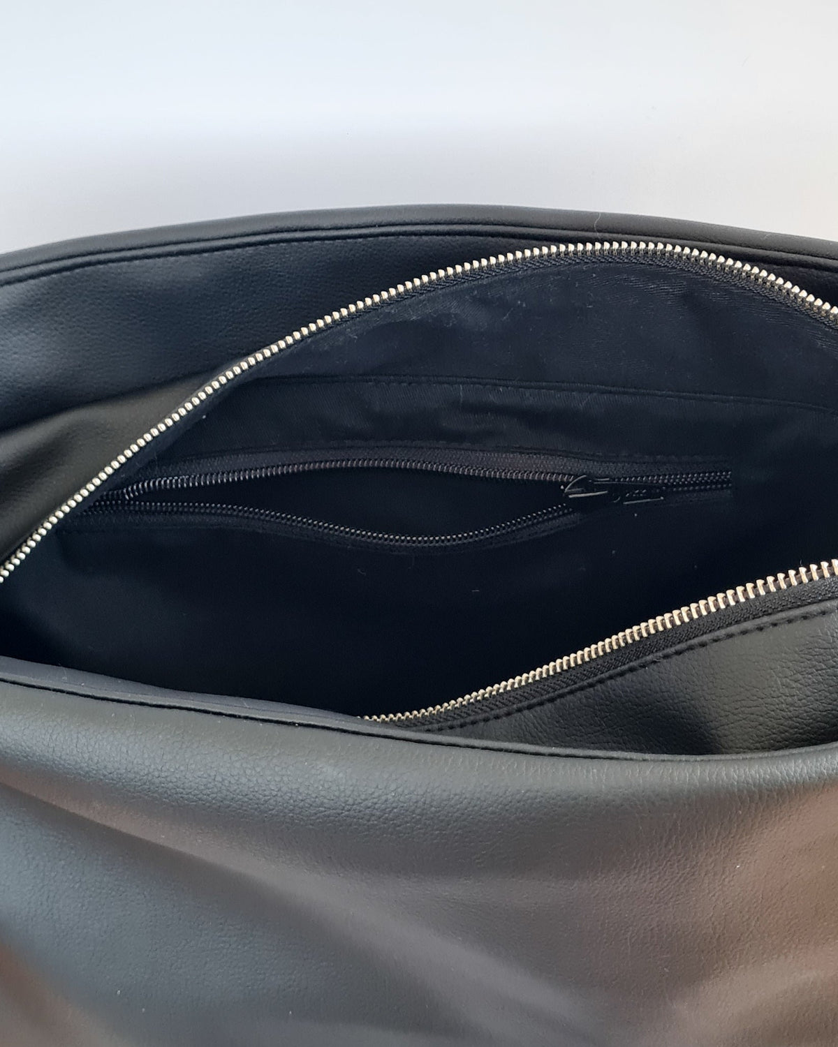 Cactus leather tote back with curved bottom panel, and adjustable buckled strap